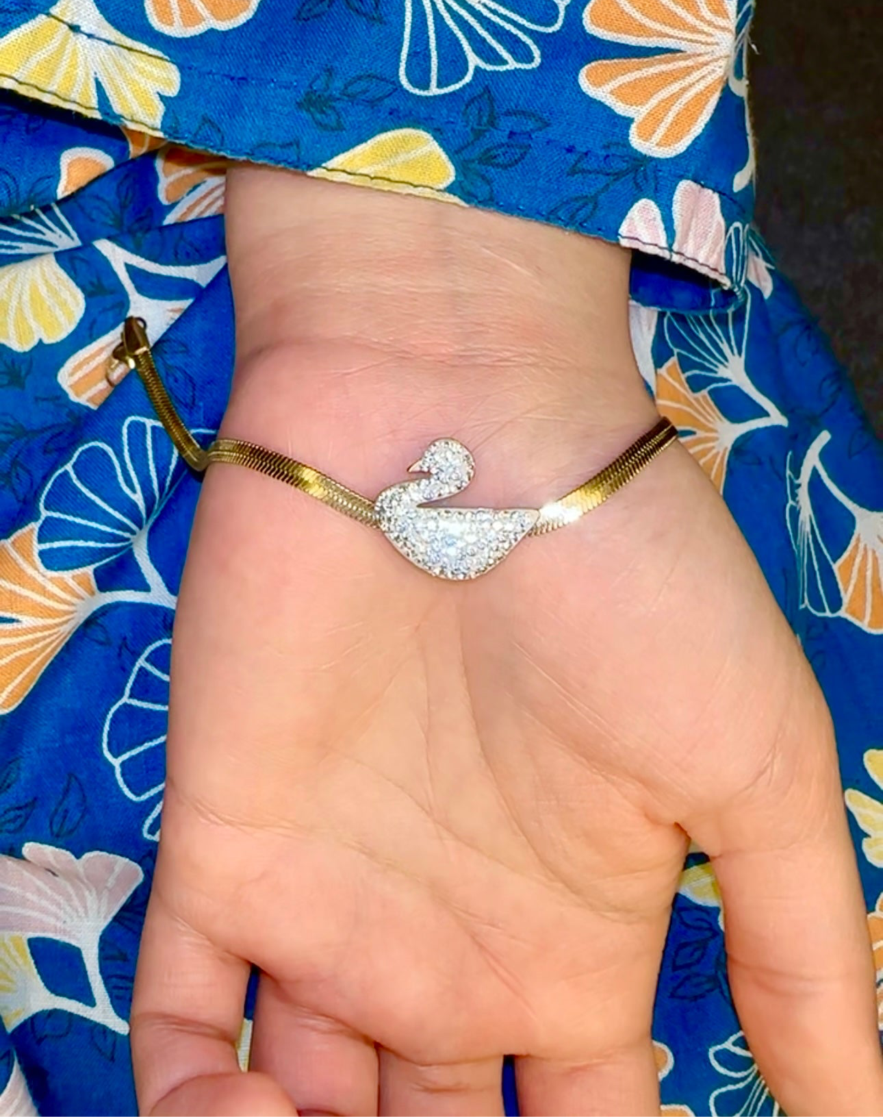 Swan-Inspired Bracelet with Gold Chain and Crystal Detailing