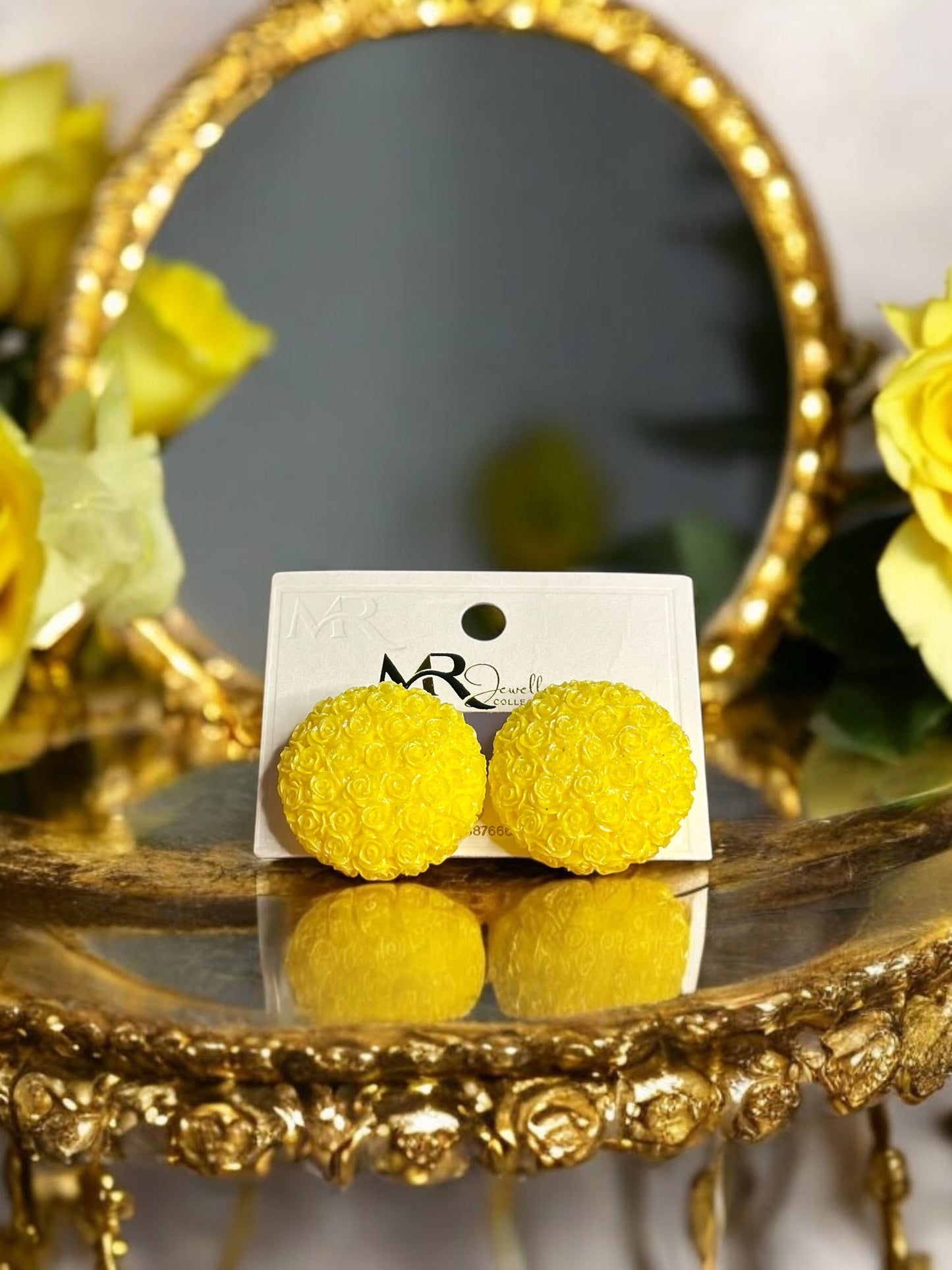 yellow floral studs with intricate detailing for a cheerful