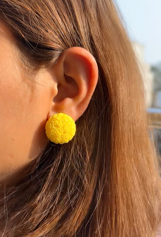 yellow floral studs with intricate detailing for a cheerful